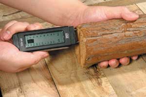 Testing wood using a Damp Meter.